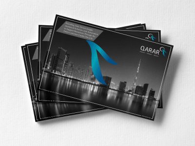 Mockup of business cards fan stack at white textured paper background.